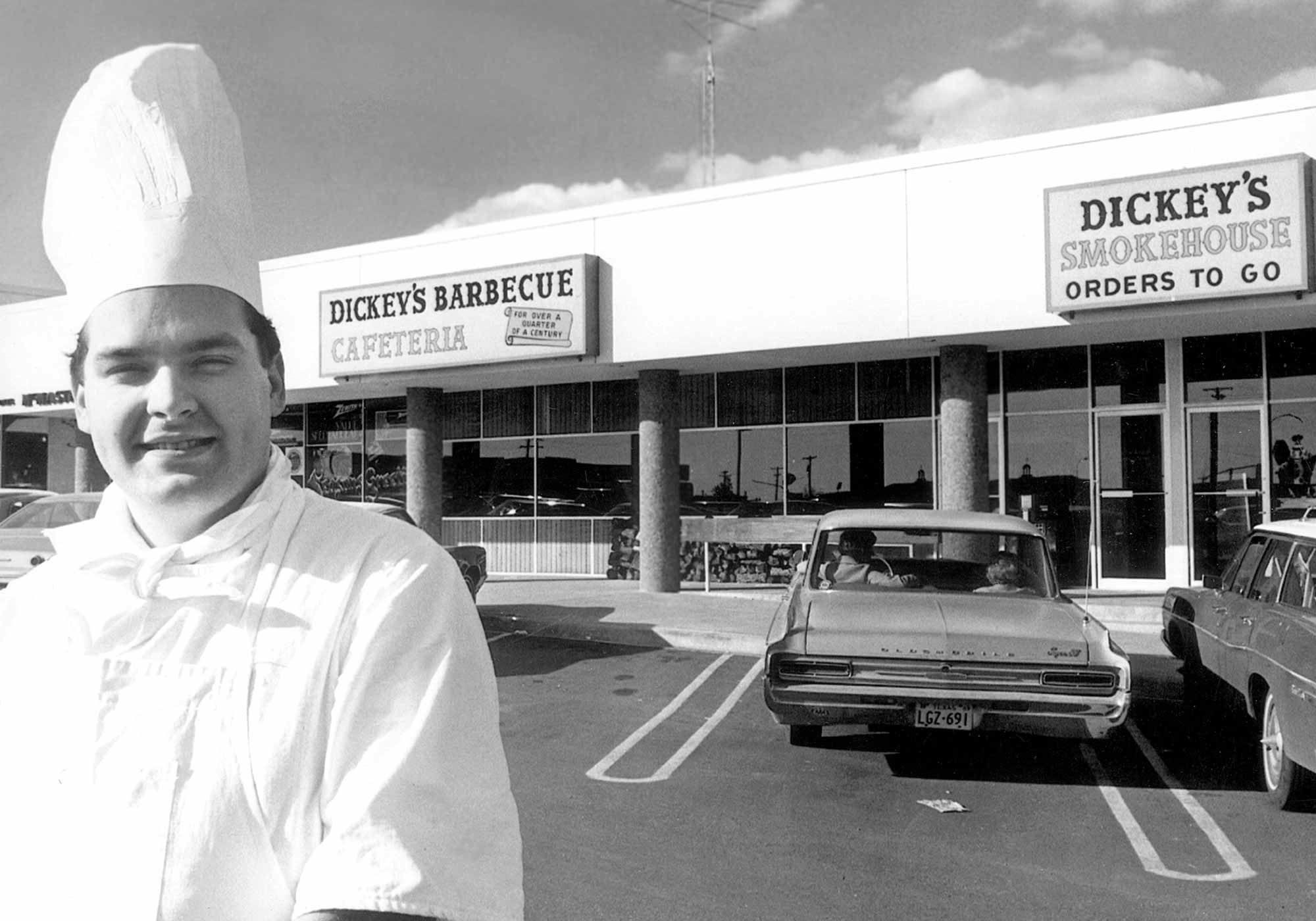 Dickeys Timeline - Chef infront of the first Dickey's restaurant